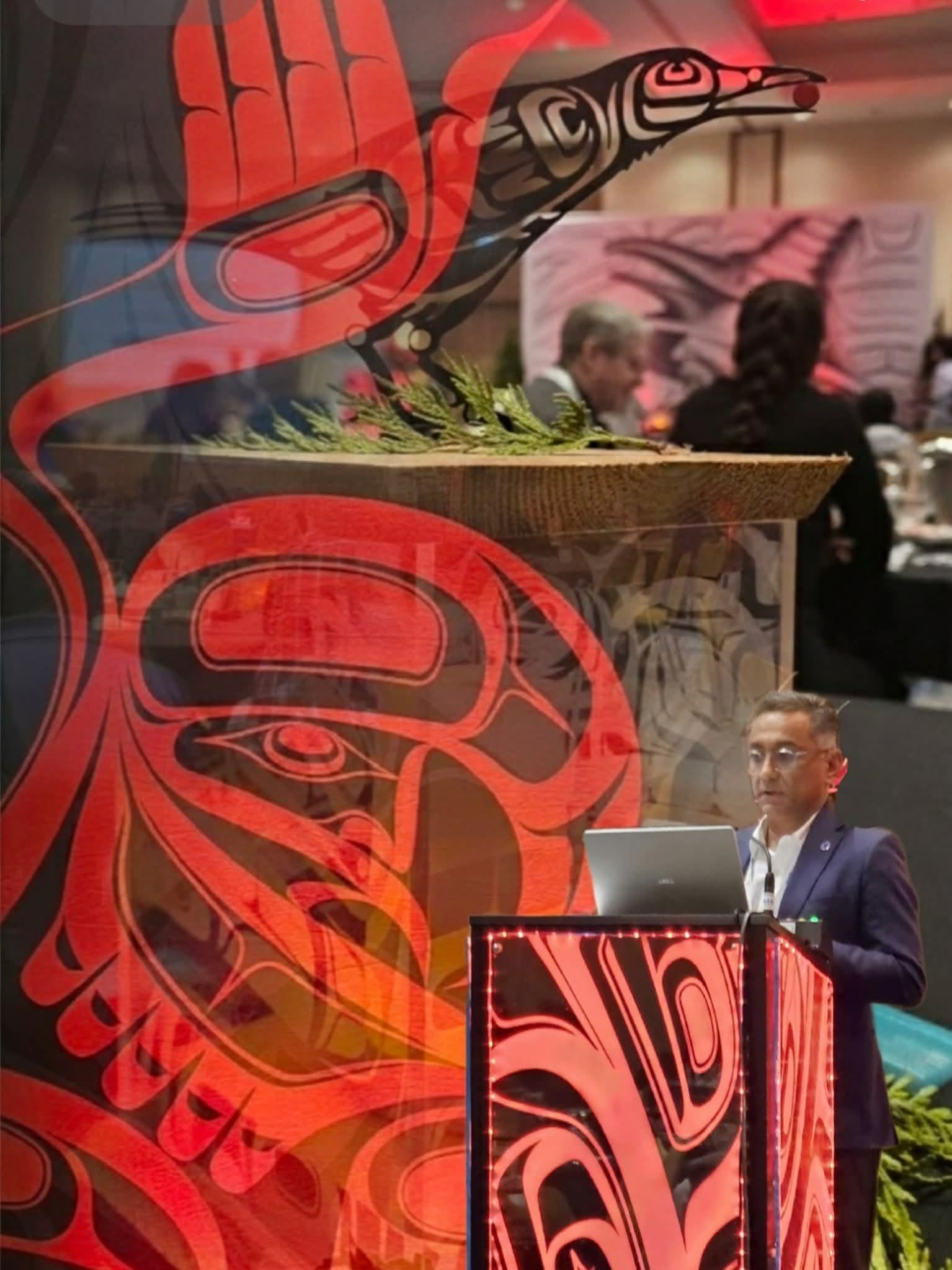 Red illuminated podium and Raven décor at an AFOA gathering