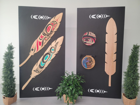Black display boards customized with feathers and drums