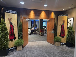 Sacred Ladies Welcome panels at an entrance