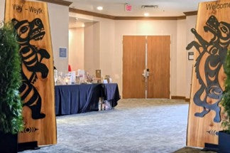 Bear and Wolf Welcome panels at an entrance