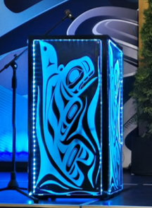 Blue illuminated Orca podium